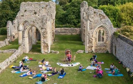 A wide shot of Creake Abbey showing a Sound Bath taking place