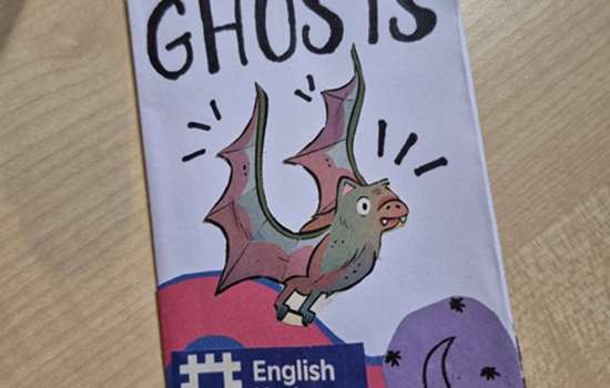 A handmade purple booklet, with the heading reading 'Ghosts.''